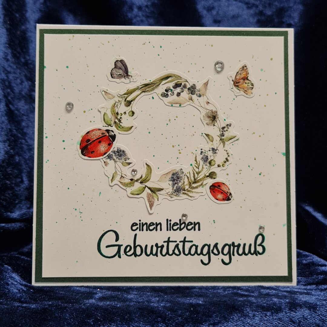 Blumenkranz mit Marienkäfer